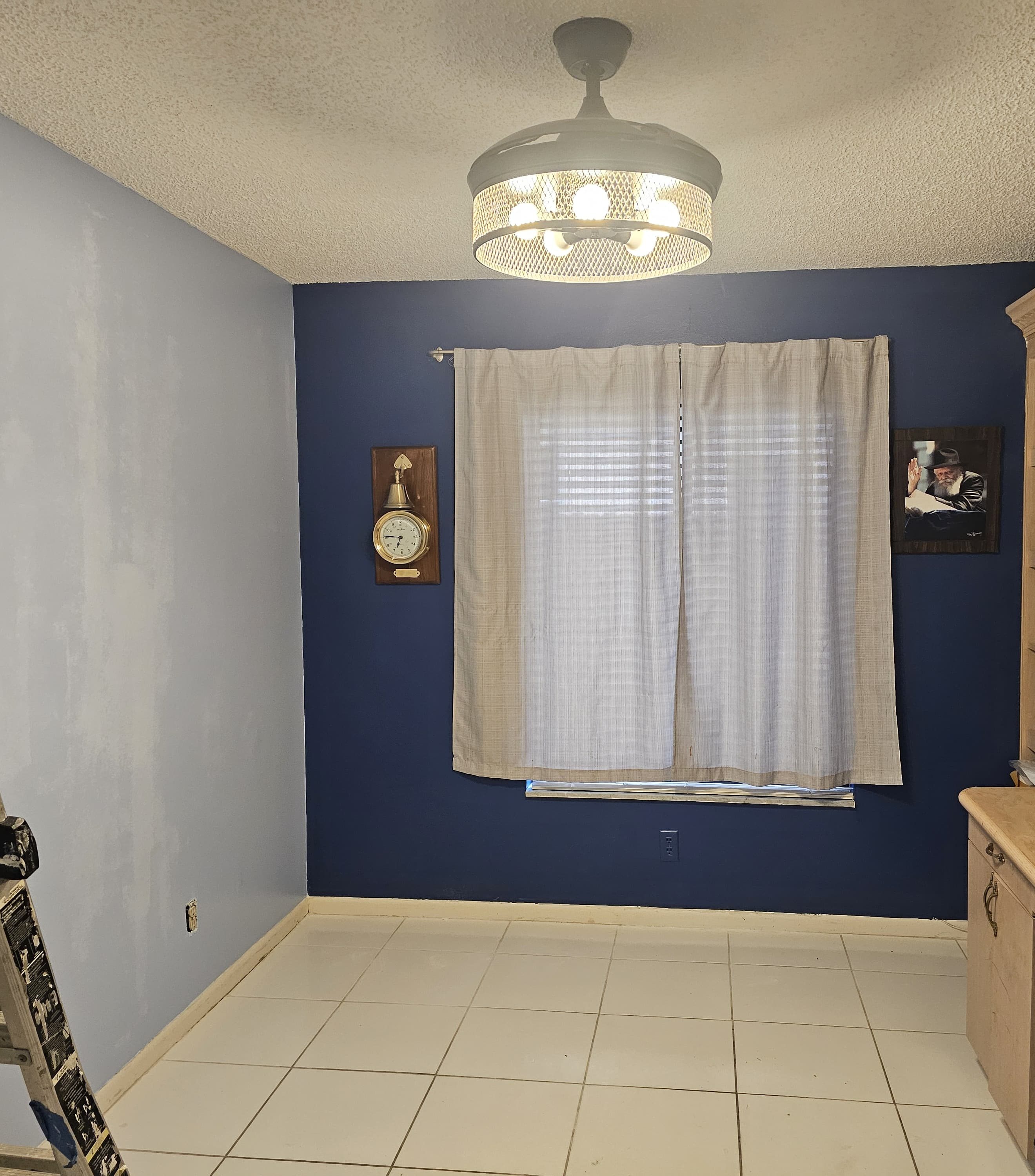 Room after painting navy accent wall Boca Raton